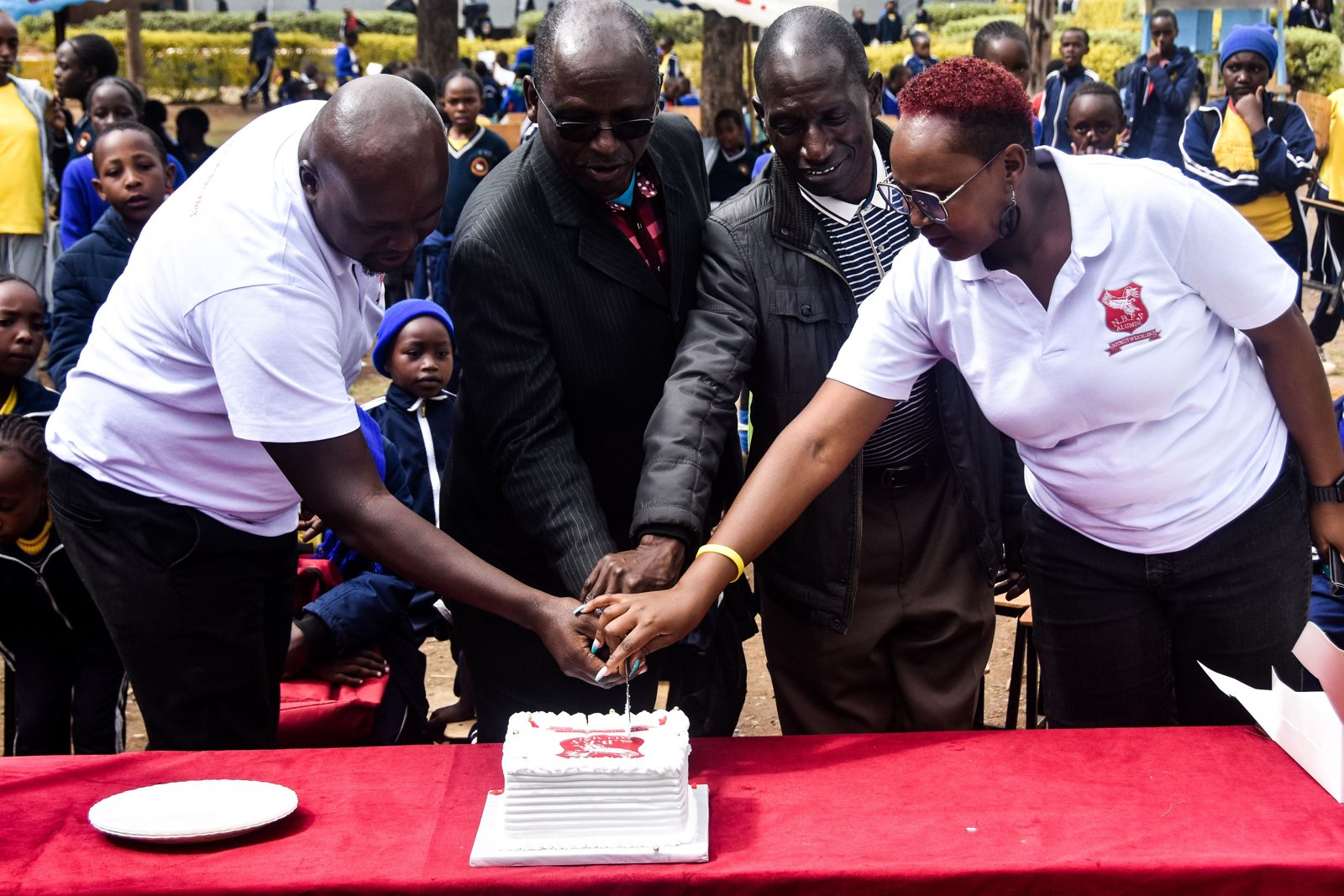 Cutting the Alumni Day cake