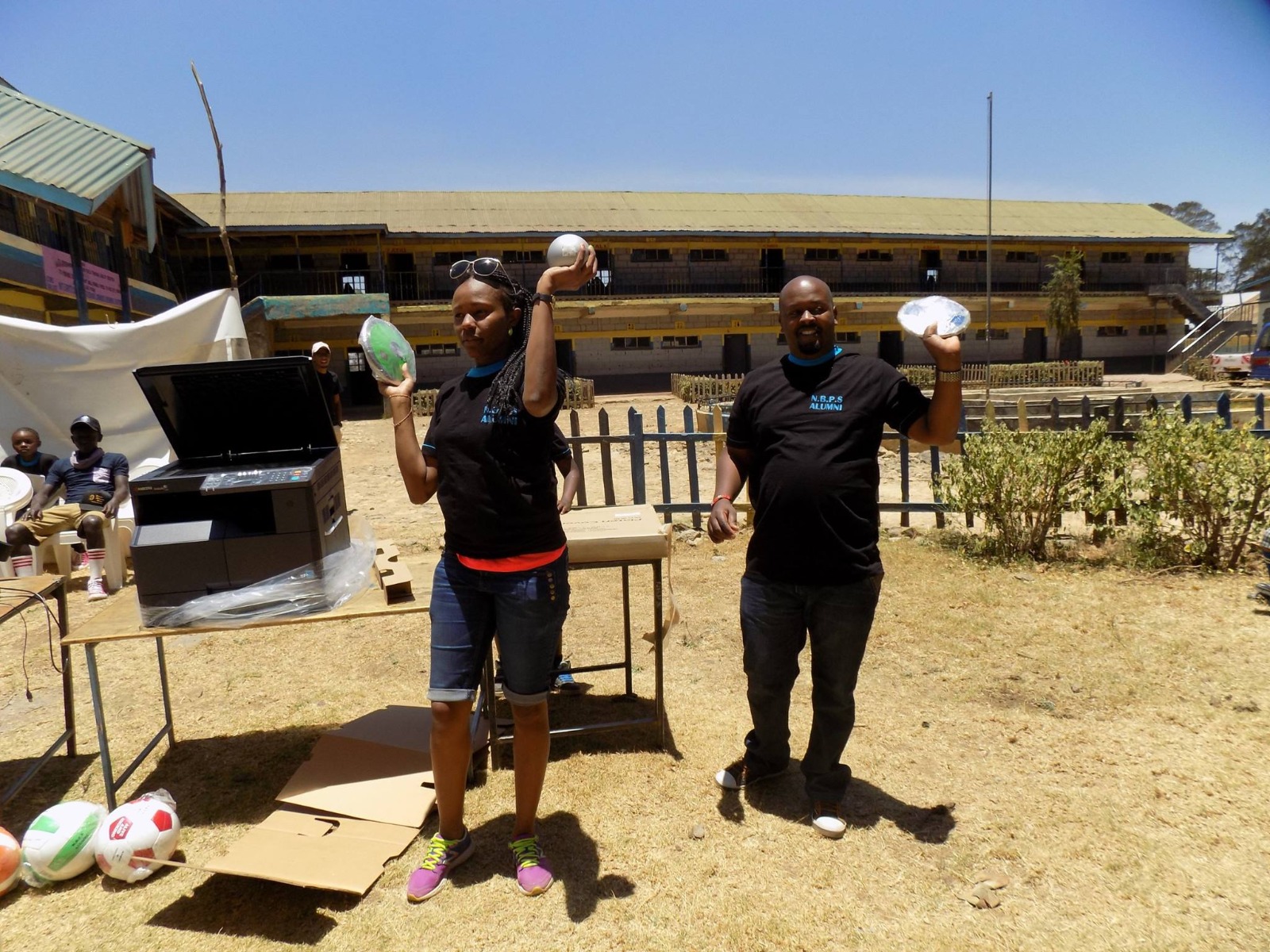 Alumni with the photocopier and sports equipment